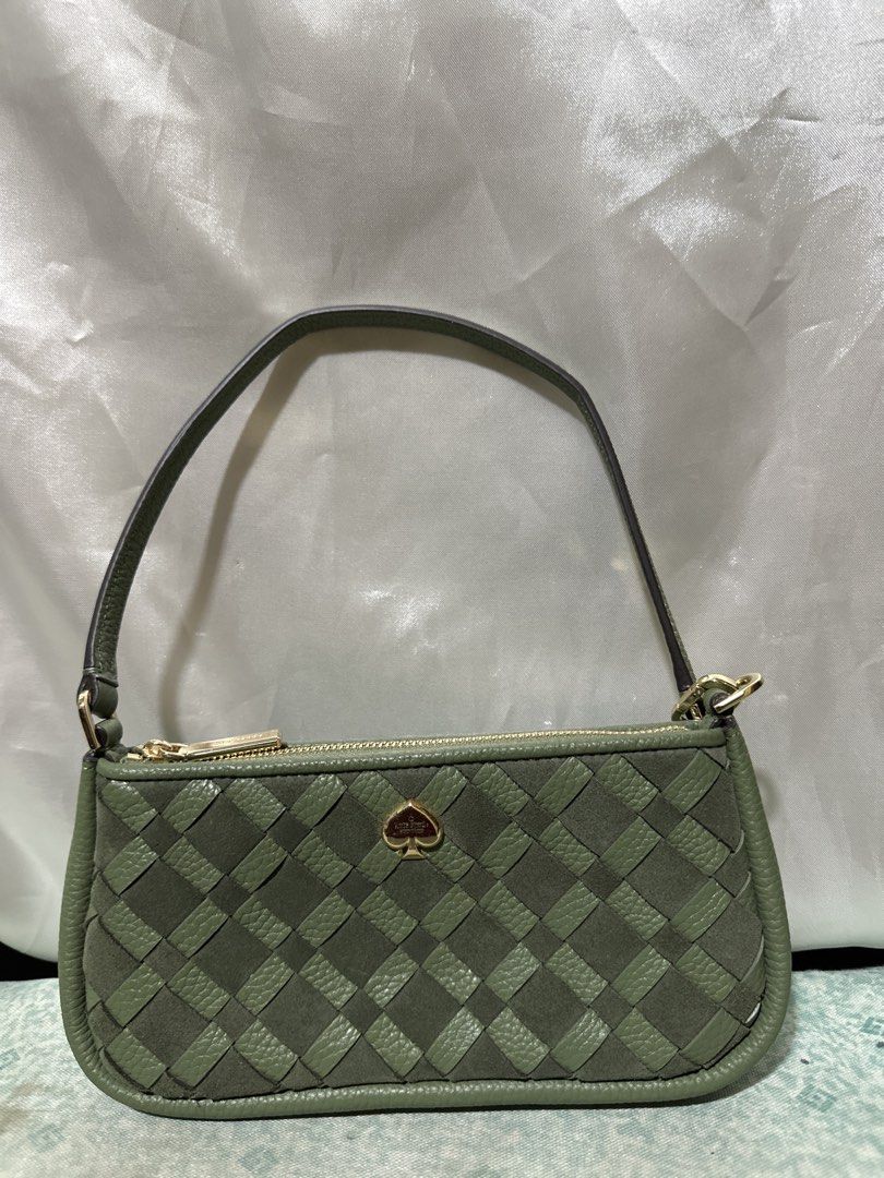 Kate Spade Woven Shoulder Bag Green (Category: Shoulder Bags) located in Balanga. Submitted by jk2025. (Listing ID 1463953534, Image 1). Description: - Cute green Kate Spade shoulder bag - Woven design with leather trim - Features a gold spade logo on the front - Secure zipper closure - Small and compact, ideal for carrying essentials.