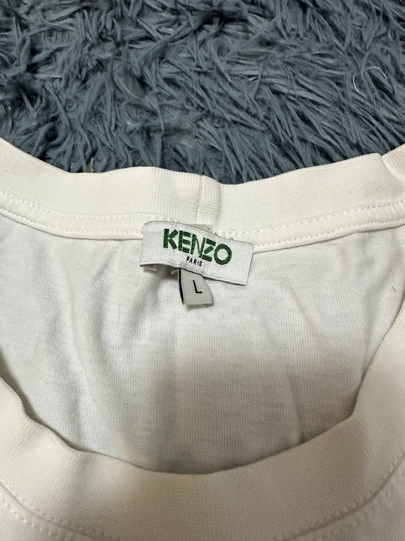 Kenzo Paris (Category: Tshirts & Polo Shirts ) located in Manila. Submitted by ceeventures (Listing ID 1464004915, Image 2). Description: Kenzo Paris (L on tag) Dimes: 20x26 Color rate: 9/0 Issue: Small yellow stain (kayang matanggal sa zonrox) Price: 350 + SF.