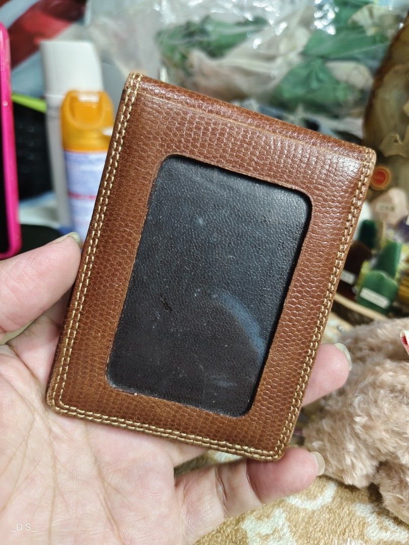 KENZO Paris Brown Leather Card Holder (Category: Wallets & Card holders) located in Lucena. Submitted by dai_suki (Listing ID 1464042047, Image 2). Description: - Genuine KENZO Paris brown leather card holder - One side features a clear window slot for easy ID/card visibility - Additional slot on the other side for extra cards - Subtle embossed KENZO logo on the front - Ideal for keeping your essential cards neatly organized.
