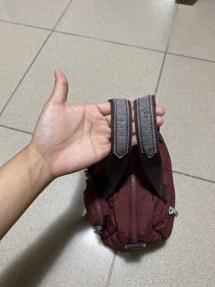 Kipling Maroon (Category: Shoulder Bags) located in Dagupan City. Submitted by maryennie (Listing ID 1464001833, Image 3). Description: Working zippers (all) Spacious interior Suitable for work, daily use or travel -Condition: Pre-loved, with visible signs of use , surface scratches/scuffs and some wear on the silver hardware. Please refer to photos for exact condition. ⭐️Selling as-is. Please inspect photos carefully before purchasing..