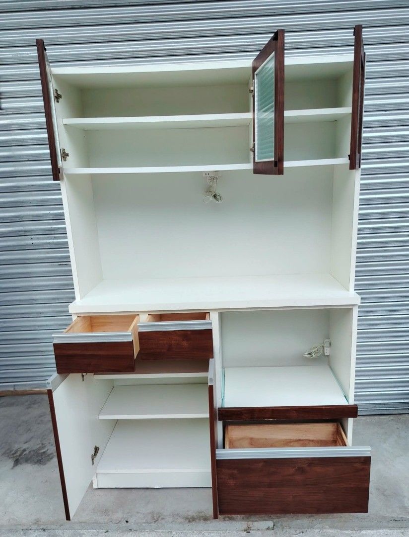 Kitchen Cabinet (Category: Shelves, Cabinets & Racks) located in Taguig. Submitted by sydney08.owl (Listing ID 1463990410, Image 2). Description: Kitchen Cabinet -Made of wood, MDF and plyboard - 3 frosted glass door for storage - with 2 electric socket - 2 small drawer for utensils - 2 wooden door cabinet for stock - 1 big drawer for storage purposes - with rice cooker storage - with microwave storage Php 9500 + delivery fee DM for more inquirie