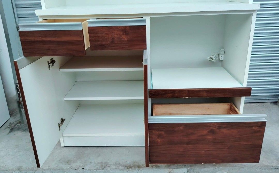 Kitchen Cabinet (Category: Shelves, Cabinets & Racks) located in Taguig. Submitted by sydney08.owl (Listing ID 1463990410, Image 3). Description: Kitchen Cabinet -Made of wood, MDF and plyboard - 3 frosted glass door for storage - with 2 electric socket - 2 small drawer for utensils - 2 wooden door cabinet for stock - 1 big drawer for storage purposes - with rice cooker storage - with microwave storage Php 9500 + delivery fee DM for more inquirie