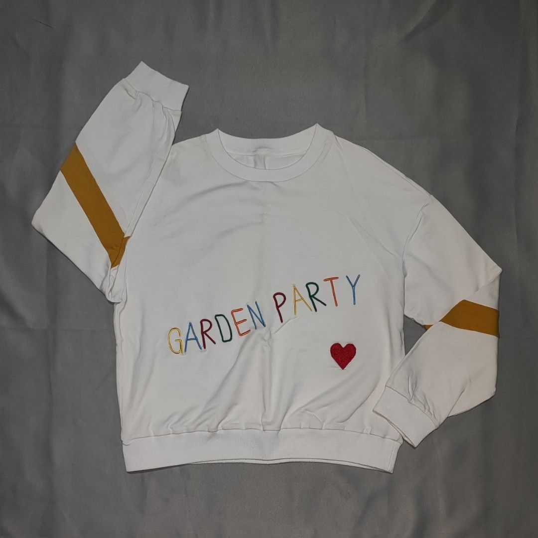 KOCH WHITE CREWNECK SWEATSHIRT (Category: Coats, Jackets and Outerwear) located in Dasmarinas. Submitted by closet_core (Listing ID 1464025876, Image 2). Description: WHITE CREWNECK SWEATSHIRT (KOCH) 📌 Description: KOCH White Crewneck Sweatshirt With Colorful "Garden Party" Embroidery & a Heart Patch Design in front With Mustard Yellow Stripes on the Sleeves Size: Small to Medium 💸 Price: PHP 280 🛑 Flaws: No flaws, just need washing. 📌 Reason