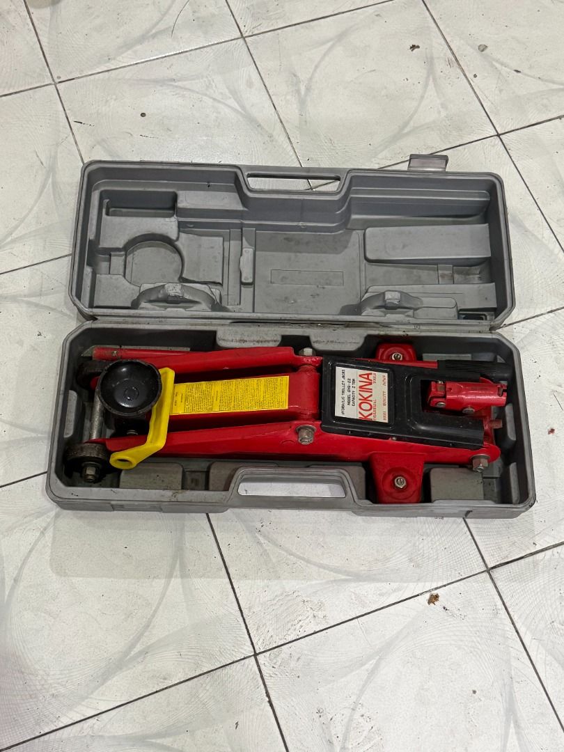 KOKINA Hydraulic Car Jack with Case (Category: Construction Tools & Equipment) located in Quezon City. Submitted by goldenwolf.1dbda9 (Listing ID 1464029835, Image 1). Description: For Sale 2 Ton Hydraulic Jack Used Once. As Is Where Is Pickup at Mandaluyong City. Php1200 Call/Text 09175263789 - Red hydraulic car jack - Comes with original grey plastic case - Ideal for emergency tire changes - Compact and easy to store in your car's trunk .