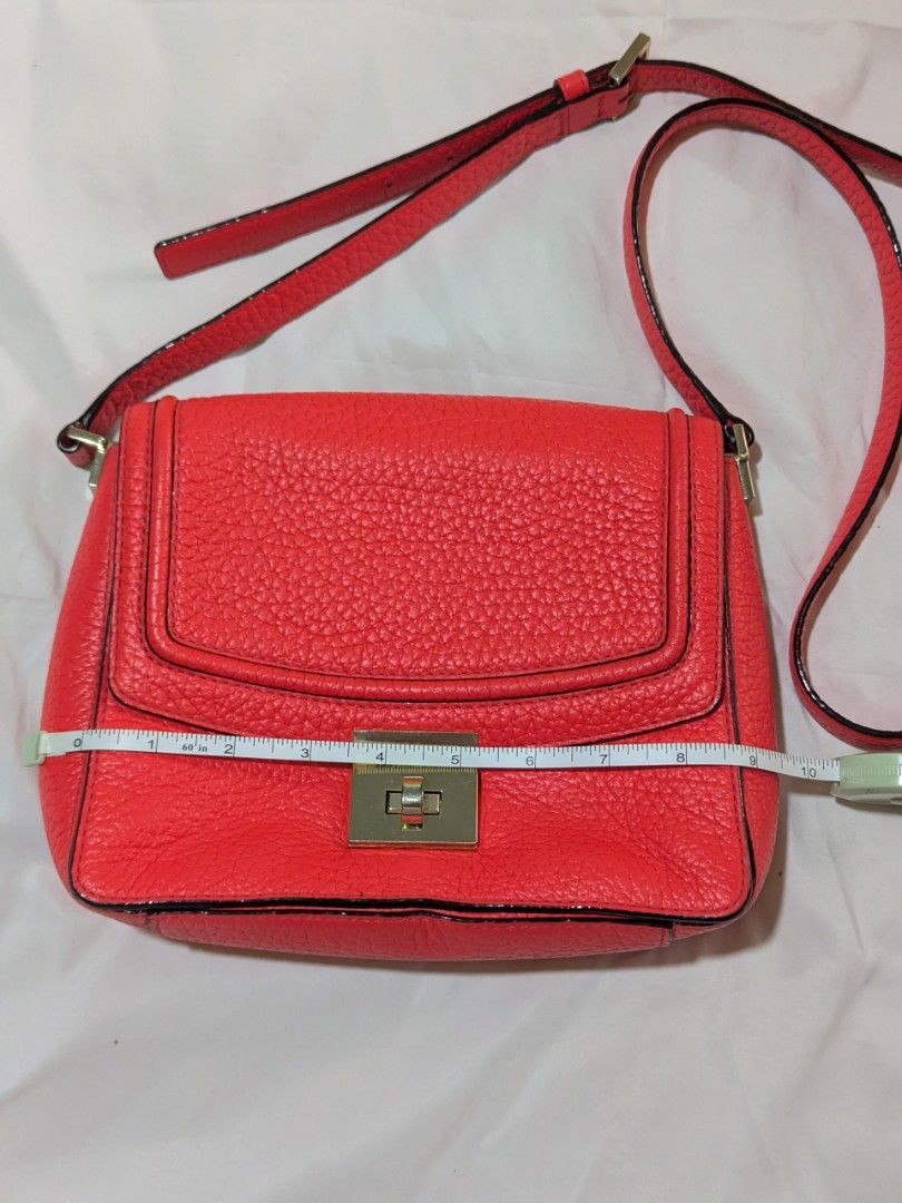 KS crossbody bag (Category: Luxury Bags & Wallets) located in Quezon City. Submitted by kuripotnya (Listing ID 1464064133, Image 2). Description: - authentic pebbled leather in crimson/red orange color - adjustable Cross body/shoulder bag - size shown in photos - scratches on hardware - clean interior - preloved excellent condition 9.8/10.