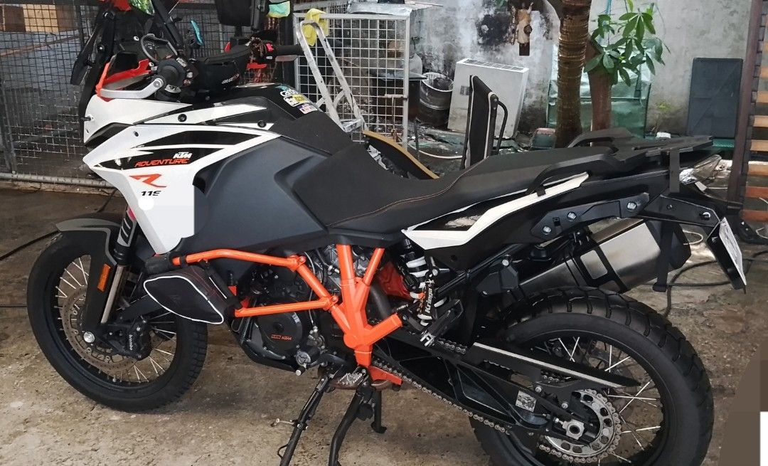 KTM 1190 Adventure R Motorcycle (Category: Motorbikes for Sale) located in Makati City. Submitted by cleverfox_289a00 (Listing ID 1463947441, Image 2). Description: KTM 1190 Adventure R. Ready for your next adventure. Orange frame, black and white body. Has saddlebags and a luggage rack. Tires look good. Ready to ride..