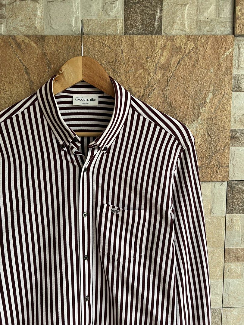 LACOSTE - STRIPE POCKET BUTTON DOWN LONGSLEEVES (Category: Formal Shirts) located in Bacolod City. Submitted by timelessbyjosh (Listing ID 1464125526, Image 2). Description: BEST FOR CASUAL & FORMAL OUTFITS SIZE : 4 ACTUAL COLOR : MAROON & WHITE COLOR RATE : 10 OUT OF 10 CONDITION : NEAR NEW MATERIAL : 75 % COTTON & 25 % POLYESTER MADE IN : JAPAN FLAWS : NONE DIMENSIONS LENGTH - 30 WIDTH ( ARMPIT TO ARMPIT ) - 19. 5 SHOULDER TO SHOULDER - 18. 5 S