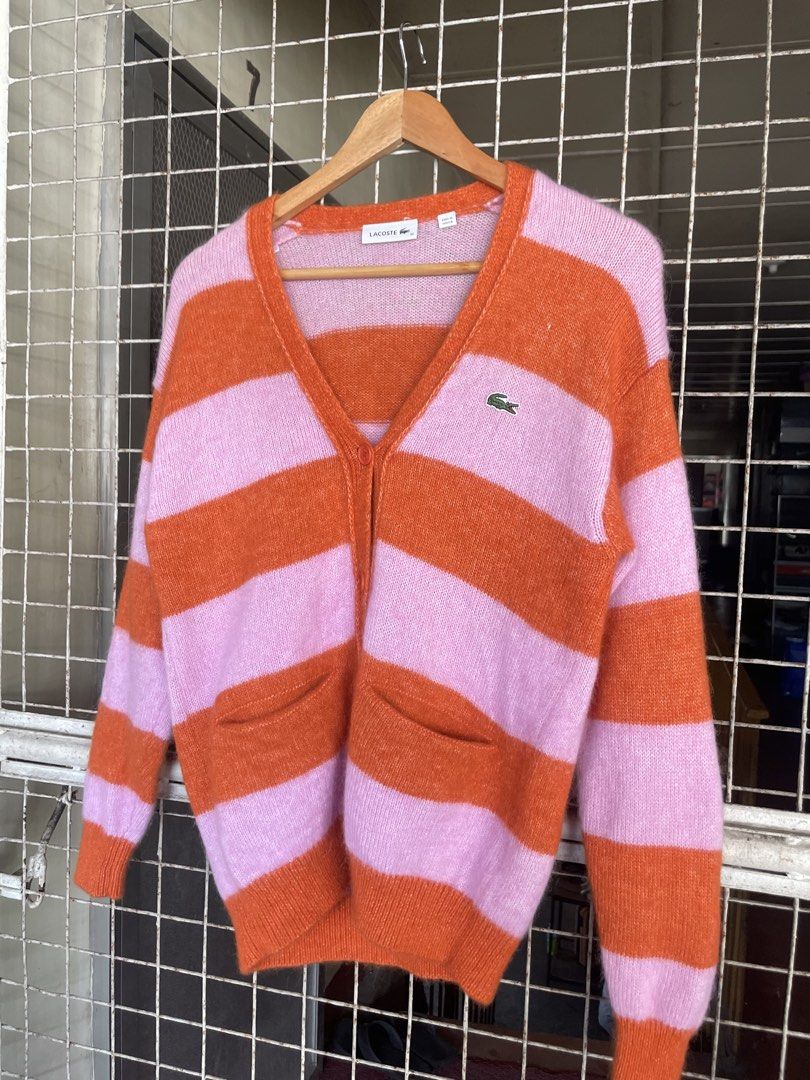 Lacoste Alpaca Blend V-Neck Cardigan (Category: Luxury Apparel) located in Manila. Submitted by oftherack_04 (Listing ID 1463991250, Image 2). Description: 🐊 Brand: Lacoste 📏 Size: 32 (as shown on tag) 🌍 Made in Tunisia 🎨 Color: Pink & Orange 🧶 Style: Striped knit cardigan 👕 Features: V-neck, button front, long sleeves, 2 front pockets ✨ Design: Bold retro-inspired color blocking with a relaxed, stylish look 🏷️ Style/PO#: EAF7042.