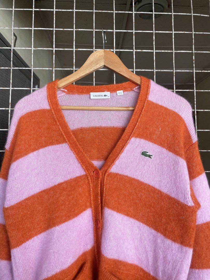 Lacoste Alpaca Blend V-Neck Cardigan (Category: Luxury Apparel) located in Manila. Submitted by oftherack_04 (Listing ID 1463991250, Image 3). Description: 🐊 Brand: Lacoste 📏 Size: 32 (as shown on tag) 🌍 Made in Tunisia 🎨 Color: Pink & Orange 🧶 Style: Striped knit cardigan 👕 Features: V-neck, button front, long sleeves, 2 front pockets ✨ Design: Bold retro-inspired color blocking with a relaxed, stylish look 🏷️ Style/PO#: EAF7042.