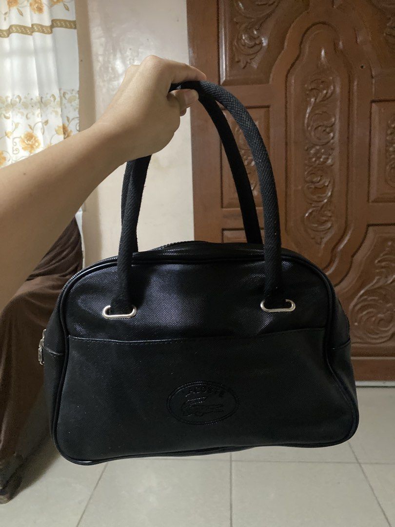 Lacoste Bowling Black Bag (Category: Shoulder Bags) located in Dagupan City. Submitted by maryennie (Listing ID 1464000104, Image 2). Description: Working zippers (all) Spacious interior Structured design Suitable for work, daily use or travel -Condition: Pre-loved, with visible signs of use .Please refer to photos for exact condition. ⭐️Selling as-is. Please inspect photos carefully before purchasing..