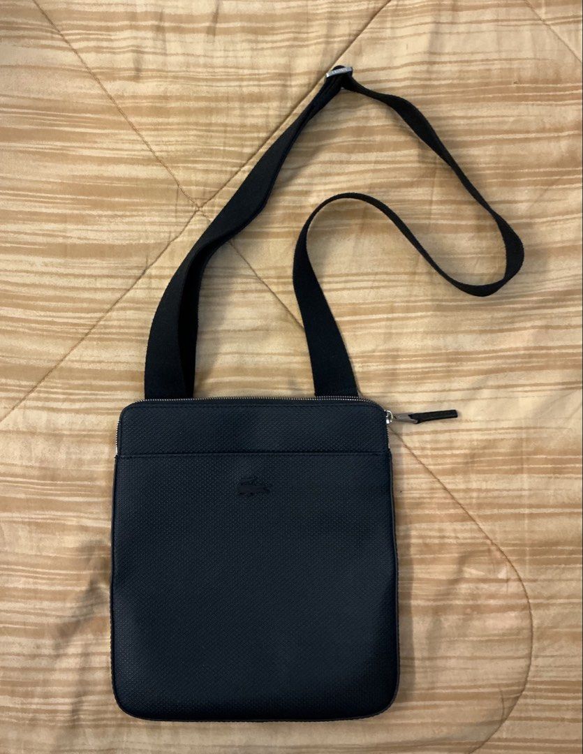 Lacoste Black Textured Crossbody Bag (Category: Cross-body Bags) located in Manila. Submitted by johnmichaelgomez419 (Listing ID 1464000528, Image 1). Description: Selling my Lacoste black sling/crossbody bag Slightly used lang, around 5 times ko pa lang nagamit. Still in very good condition and no major flaws. Selling it since hindi ko na rin masyadong nagagamit. ₱4,500 — negotiable pa! Original Lacoste. Simple and classic design, bagay for ever