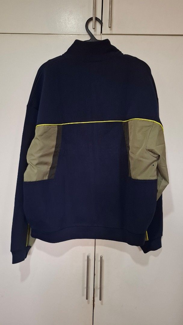 Lacoste Brand New with Tags Navy Jacket (Category: Coats, Jackets and Outerwear) located in Quezon City. Submitted by mmmegg (Listing ID 1463957517, Image 3). Description: Brand new with tags and bag. Loose fit. Navy, with olive green detailing. Option is also to trade-in. We can negotiate. MoP: GCash or online banking Delivery: from QC. J&T or LBC.