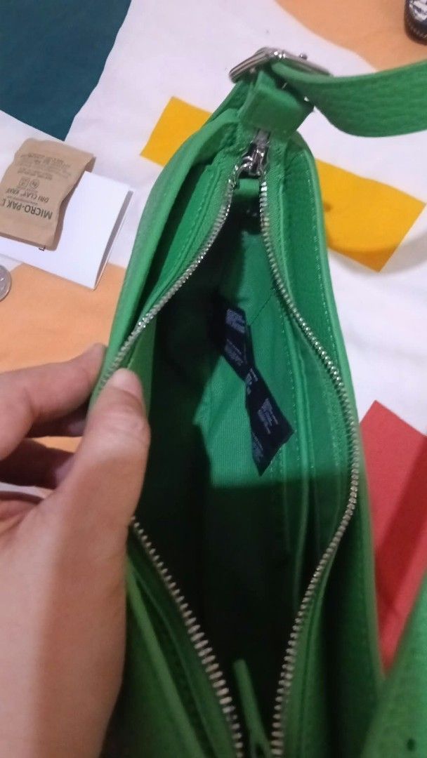 Lacoste Green Leather Crescent Shoulder Bag (Category: Shoulder Bags) located in Quezon City. Submitted by elihur.tuazon (Listing ID 1464069922, Image 2). Description: Used ONCE - Brand new condition Legit/Authentic Selling for 4.5k Green Leather Lacoste Shoulder Bag (cresent, baguette, or mini hobo bag).