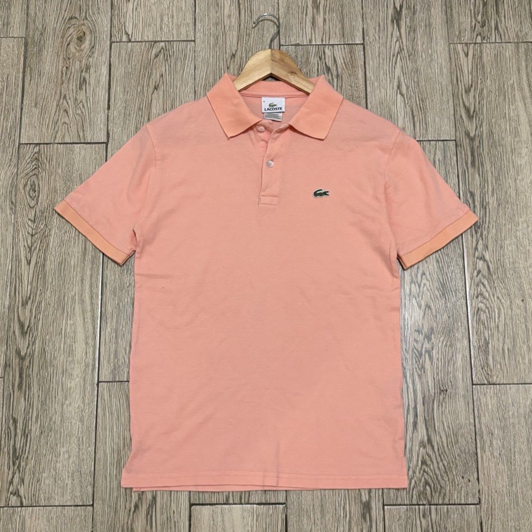 Lacoste Pink Polo Shirt (Category: Tshirts & Polo Shirts ) located in Imus. Submitted by reloved.nd (Listing ID 1464072709, Image 1). Description: - Classic pink Lacoste polo shirt - Iconic green crocodile logo on chest - Short sleeves with ribbed cuffs - Two-button placket collar - Ideal for casual or sporty outfits.