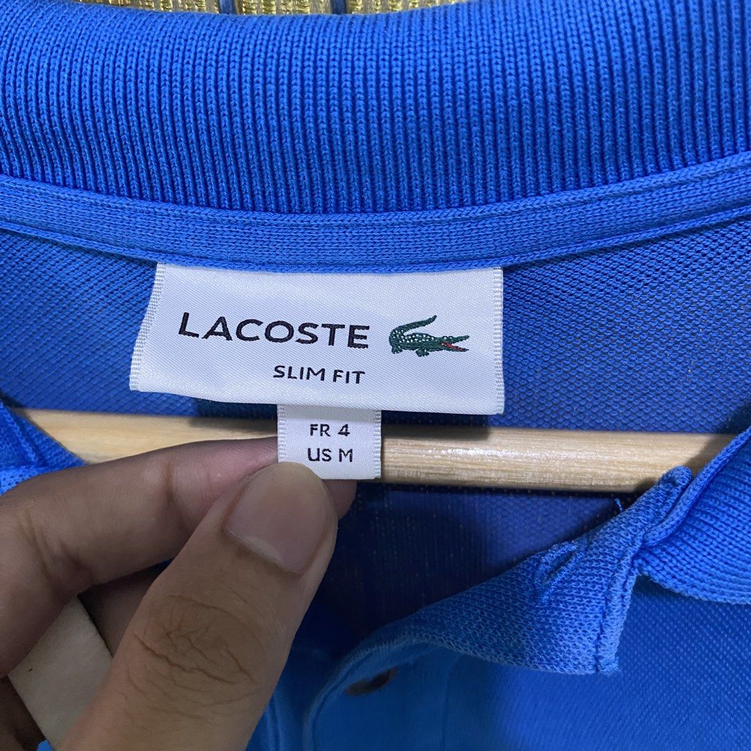 Lacoste polo shirt (Category: Luxury Apparel) located in Digos. Submitted by thriftnigoy (Listing ID 1464081973, Image 2). Description: LACOSTE PM📥 Dimes: inches Width 20 length: 28 Best fit medium - Excellent condition - color rate 9.7 - minor scratches.