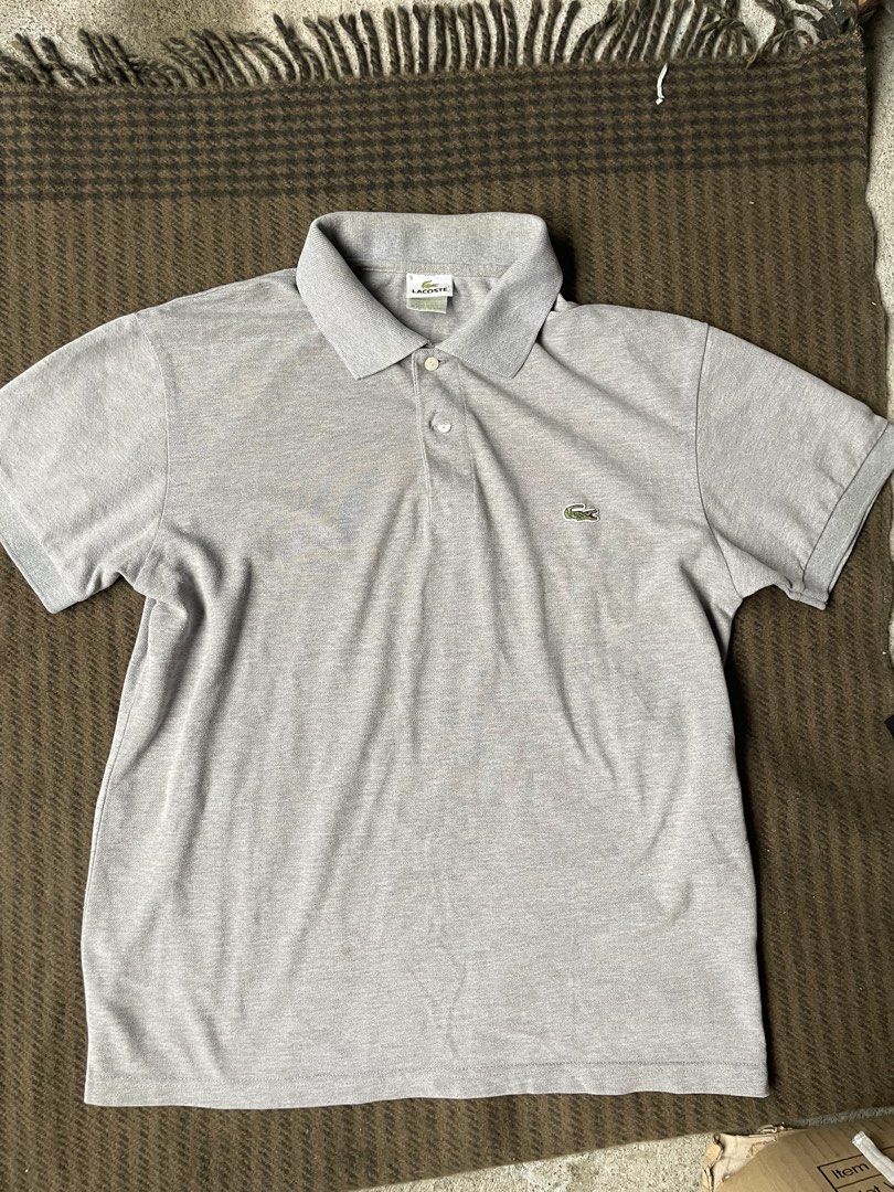 Lacoste Polo Shirt Size S Grey (Category: Tshirts & Polo Shirts ) located in Siniloan. Submitted by rethr1ft (Listing ID 1463969094, Image 1). Description: - 27x20 Dimes - Grey Lacoste Polo Shirt - Size: M - Classic short-sleeve design - Two-button placket - Iconic crocodile logo - Designed in France, Made in Peru - Ideal for casual wear.