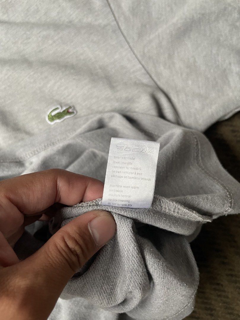 Lacoste Polo Shirt Size S Grey (Category: Tshirts & Polo Shirts ) located in Siniloan. Submitted by rethr1ft (Listing ID 1463969094, Image 3). Description: - 27x20 Dimes - Grey Lacoste Polo Shirt - Size: M - Classic short-sleeve design - Two-button placket - Iconic crocodile logo - Designed in France, Made in Peru - Ideal for casual wear.