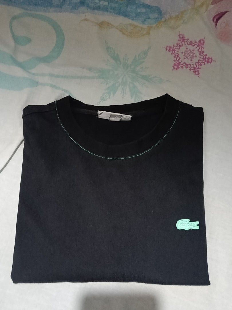 Lacoste Regular Fit Black T-Shirt (Category: Tshirts & Polo Shirts ) located in Bolinao. Submitted by joshuathrift (Listing ID 1464076109, Image 1). Description: - Authentic Black Lacoste T-shirt - Size: Medium (FR 4) - Iconic green crocodile logo embroidered on the chest - Stylish contrast stitching on collar, sleeves, and hem - Regular fit, ideal for everyday casual wear.