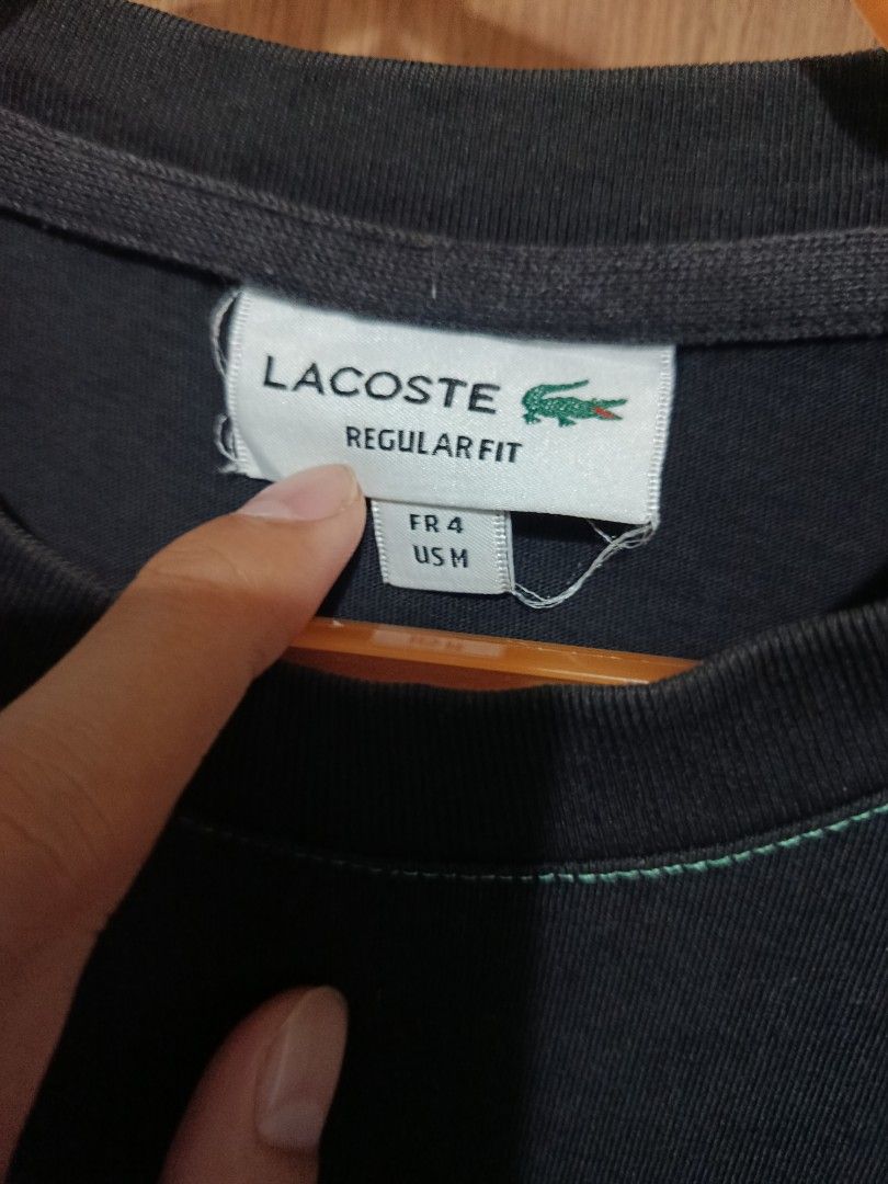 Lacoste Regular Fit Black T-Shirt (Category: Tshirts & Polo Shirts ) located in Bolinao. Submitted by joshuathrift (Listing ID 1464076109, Image 3). Description: - Authentic Black Lacoste T-shirt - Size: Medium (FR 4) - Iconic green crocodile logo embroidered on the chest - Stylish contrast stitching on collar, sleeves, and hem - Regular fit, ideal for everyday casual wear.