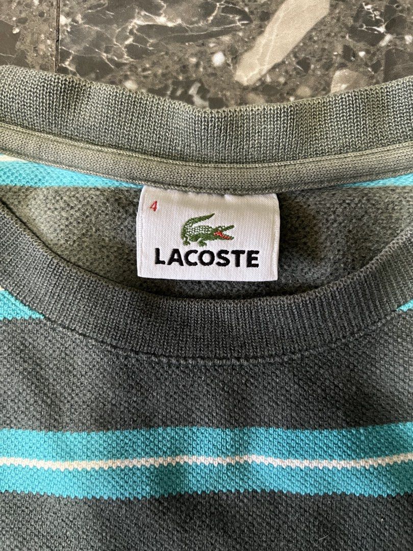 Lacoste Striped Sweatshirt (Category: Coats, Jackets and Outerwear) located in Manila. Submitted by justin_sy (Listing ID 1463982118, Image 3). Description: - Grey and blue striped sweatshirt from Lacoste - Features the classic crocodile logo on the chest - Size: 4 - Ideal for casual wear.