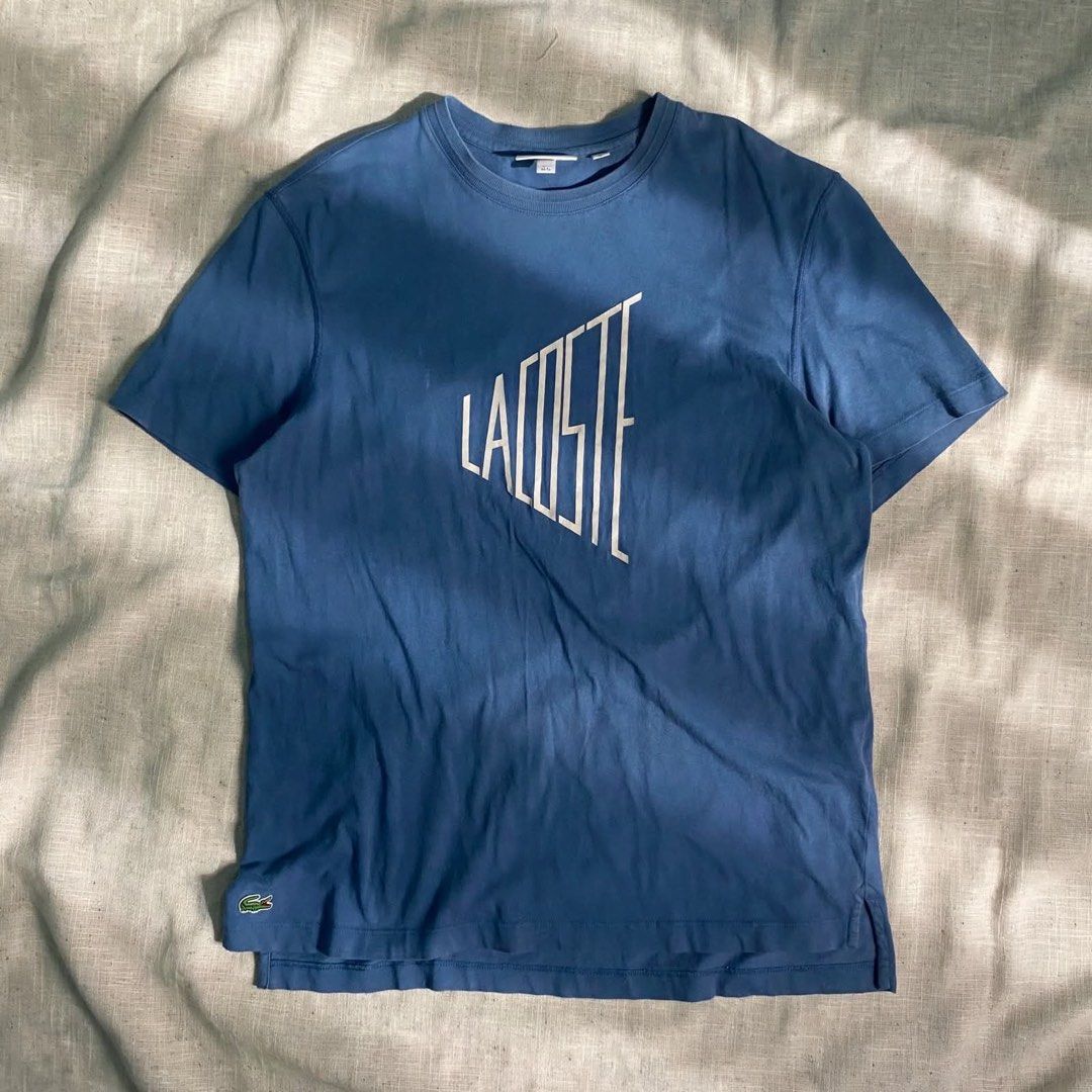 Lacoste tshirt (Category: Luxury Apparel) located in Digos. Submitted by thriftnigoy (Listing ID 1463998287, Image 1). Description: LACOSTE PM📥 Dimes: inches Width 22 length: 28-29 Best fit large - Excellent condition - color rate 9.6 - no issue.