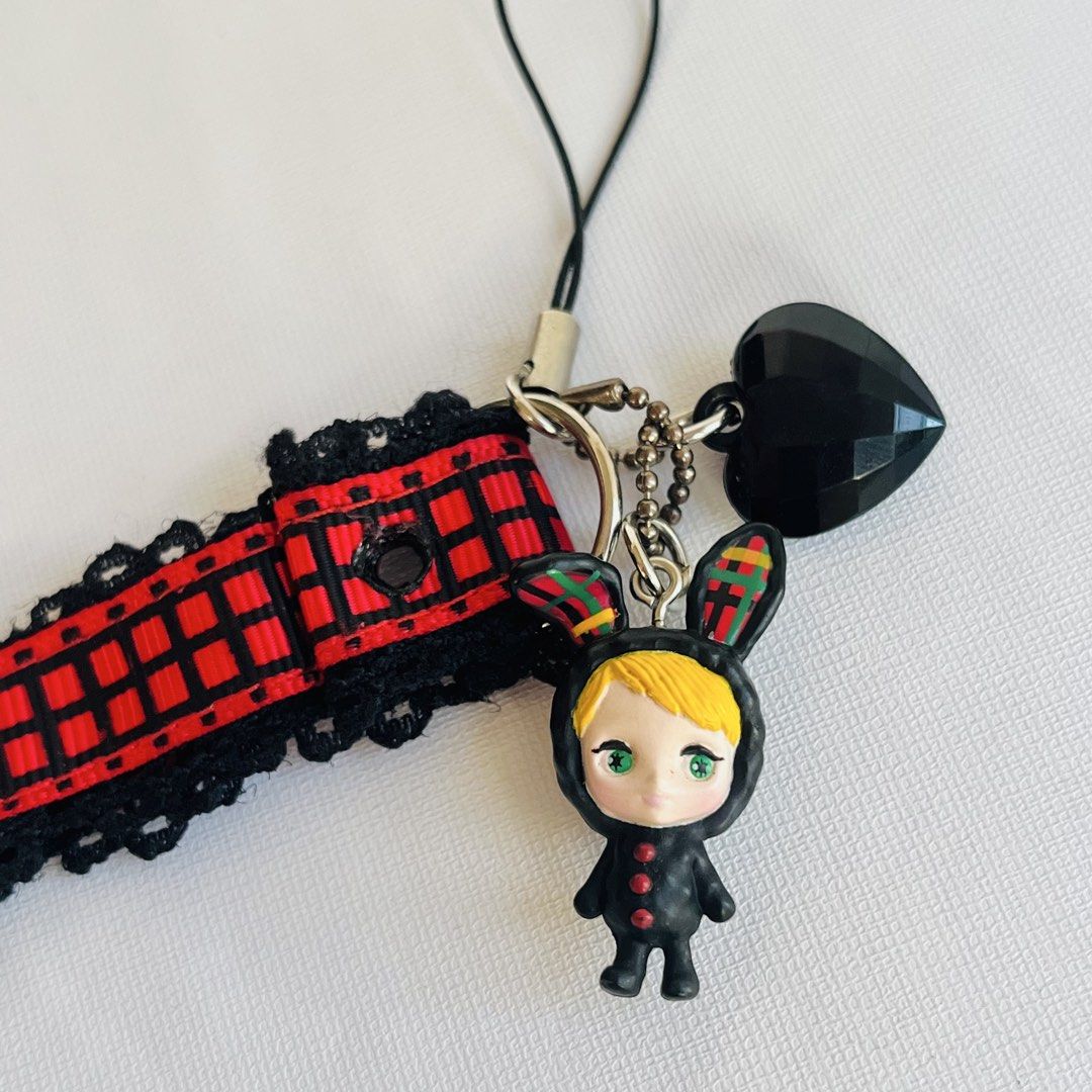 Lala Blythe Strap Bunny Black Keychain (Category: Charms) located in Cabuyao City. Submitted by nyannyancore (Listing ID 1464016654, Image 2). Description: - Adorable bunny charm with a black heart dangle. - Features a red and black plaid ribbon with black lace trim. - Ideal for decorating bags, phones, or keychains. - Adds a unique touch and personality to your everyday items..