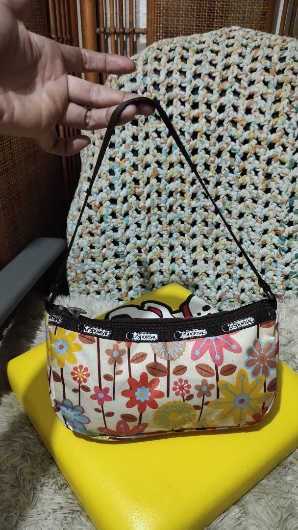 LeSportsac Floral Shoulder Bag (Category: Shoulder Bags) located in Cebu City. Submitted by lumaynojes00490 (Listing ID 1463962274, Image 2). Description: - Cute LeSportsac shoulder bag - Fun floral print - Dark brown strap - Compact size for essentials - Secure zipper closure - Ideal for everyday or casual outings - Adds a pop of color to your outfit.