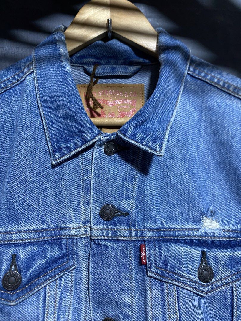 Levi's Denim Jacket - Blue - Size M (Category: Coats, Jackets and Outerwear) located in Antipolo. Submitted by drop.thrifts (Listing ID 1463961889, Image 2). Description: - Classic blue Levi's denim jacket - Made in Thailand - 100% Cotton - Iconic red tab and button closure - Subtle distressed details on fabric - Ideal for layering - Dimes: 20.5x25.5 - 1,200 free shipping .