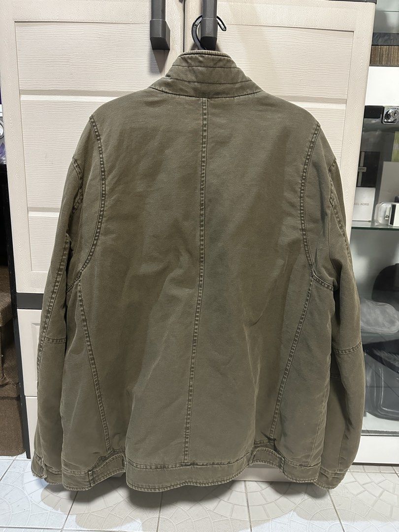 Levi's Olive Green Utility Jacket XXL (Category: Coats, Jackets and Outerwear) located in Valenzuela. Submitted by mmmm14th (Listing ID 1463975319, Image 2). Description: - Olive green Levi's utility jacket - Size XXL - Zip and button-up front closure - Two chest pockets with button closure - Two side pockets - Zippered pocket on left chest - Quilted lining for warmth Chest (Pit to Pit): 24 inches Length: 30 inches Shoulder: ~20–21 inches Good co
