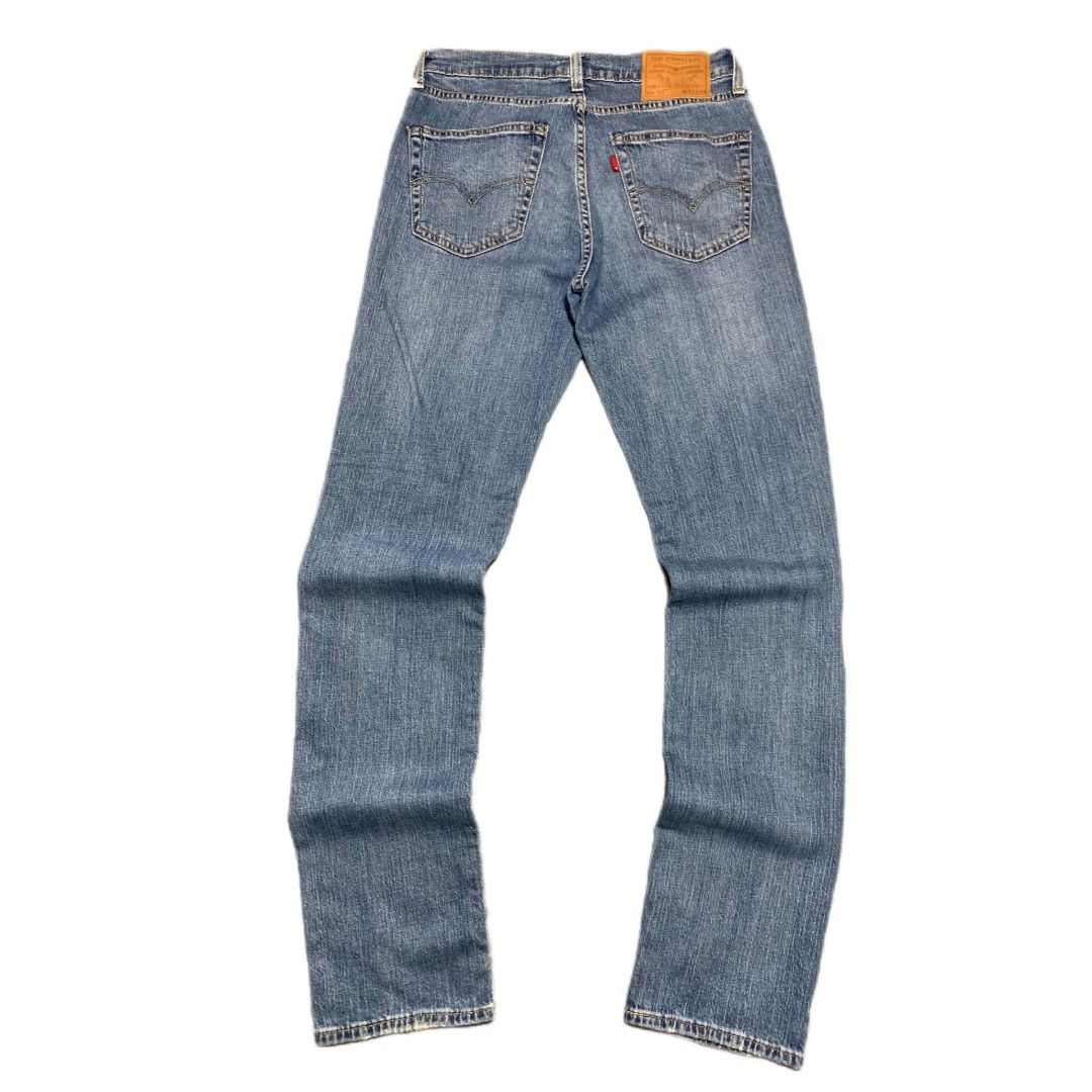 Levi's 511 Slim Fit Distressed Medium Wash Jeans (Category: Jeans) located in Bislig. Submitted by rndm_stff1 (Listing ID 1463991733, Image 1). Description: Classic Levi's Premium 511 slim-fit jeans in a versatile medium wash blue denim. Features factory distressed rips across both knees, authentic Red Tab back pocket detail, zipper fly, and a clean slim silhouette throughout. Details: - Brand: Levi's Premium - Model: Lot 511 Slim - Tagged Size: 