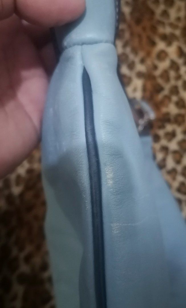 Light Blue Leather Hobo Bag (Category: Shoulder Bags) located in Cebu City. Submitted by roadthrift (Listing ID 1464041785, Image 3). Description: - Light blue leather hobo bag - Soft leather material - Zipper closure - Interior: 1 zippered pocket, 1 slip pocket - Minor marks on exterior leather (please check photos) - Ideal everyday bag.