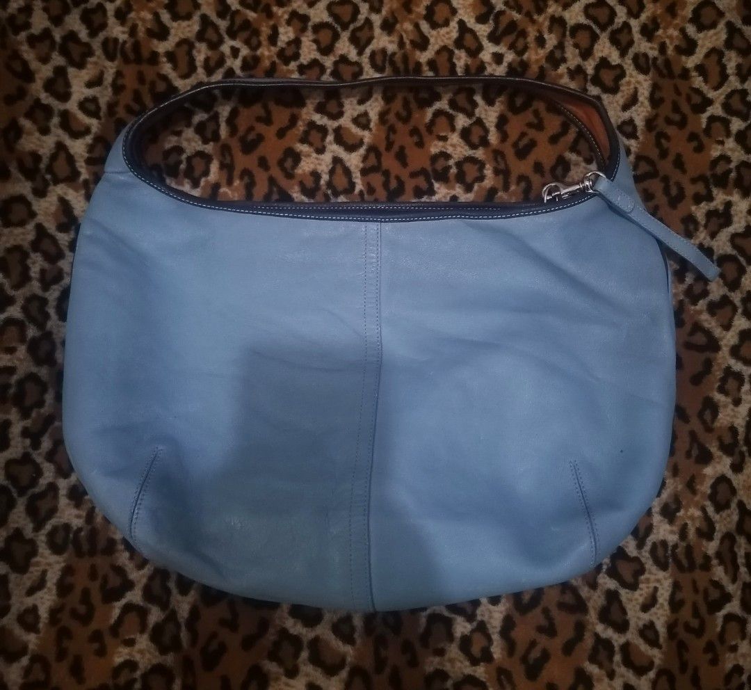 Light Blue Leather Hobo Bag (Category: Shoulder Bags) located in Cebu City. Submitted by roadthrift (Listing ID 1464041785, Image 1). Description: - Light blue leather hobo bag - Soft leather material - Zipper closure - Interior: 1 zippered pocket, 1 slip pocket - Minor marks on exterior leather (please check photos) - Ideal everyday bag.