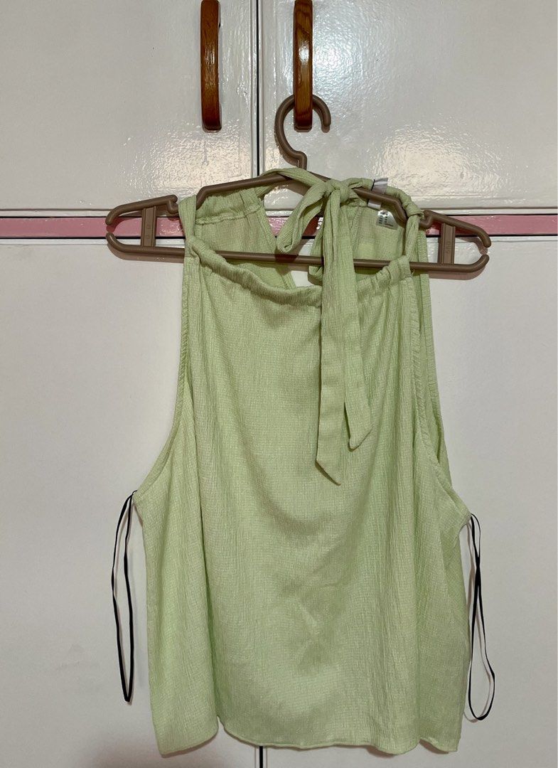 H&M Light Green Halter Neck Top with Tie Back (Category: Sleeveless) located in Marikina City. Submitted by saaaanby (Listing ID 1464024521, Image 2). Description: - H&M Halter neck with tie-back closure - SMALL TO MEDIUM BODY FRAME - USED ONCE - PHP 300 - NO LAST PRICE .