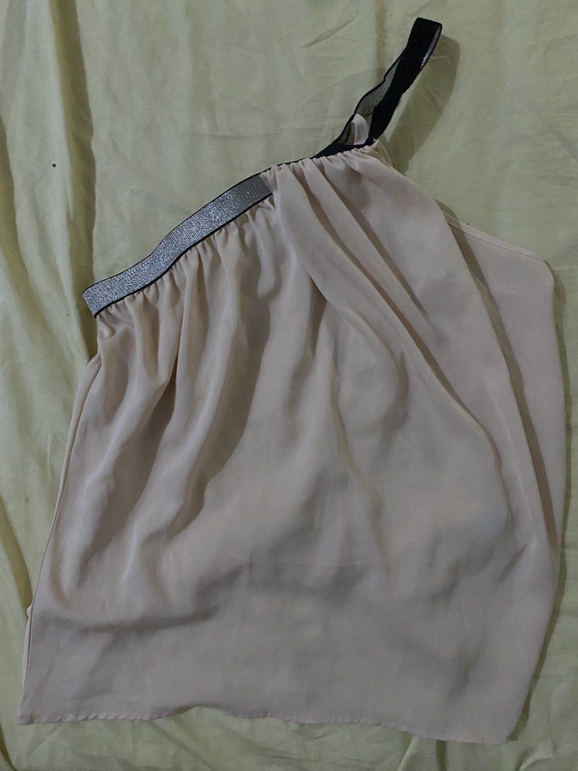 Light Pink One-Shoulder Top with Sparkly Trim (Category: Sleeveless) located in Makati City. Submitted by dinhermoso (Listing ID 1464119890, Image 1). Description: - Light pink one-shoulder top - Sparkly silver and black trim on neckline and strap - Flowy, nicely draping fabric - Ideal for night outs or casual events - Versatile: pairs easily with jeans or skirts - Worn less than 10 times Location: Salcedo Makati Pickup: Arrange/shoulder by buyer