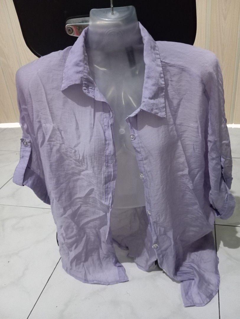 Light Purple Button-Up Shirt (Category: Shirts) located in Dasmarinas. Submitted by kei05 (Listing ID 1463957153, Image 1). Description: - Light purple button-up shirt - Sheer or lightweight material - Features a classic collar - Full front button closure - Versatile for layering or wearing on its own - Simple and classic design.