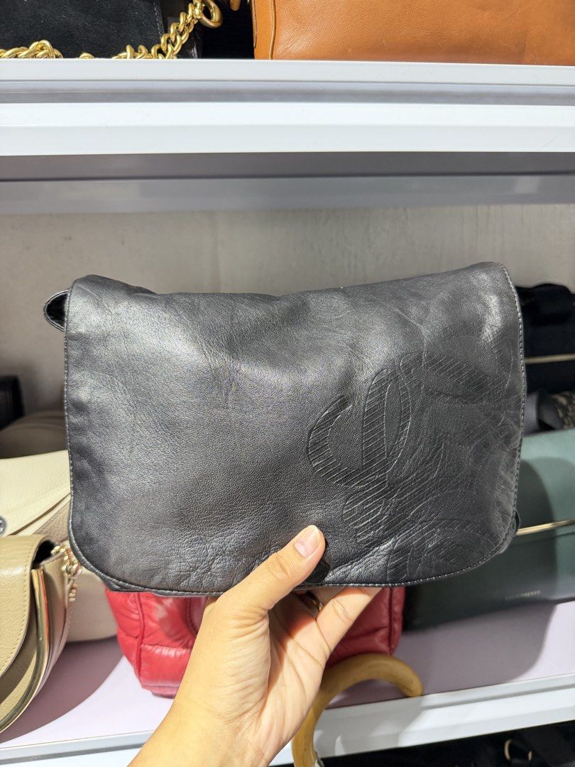 Loewe Anagram flap crossbody (Category: Luxury Bags & Wallets) located in Taguig. Submitted by xylasprelovedbag (Listing ID 1463960280, Image 1). Description: - Genuine black leather shoulder bag - Soft, slouchy silhouette - Front flap with embossed logo detail - Slightly textured leather finish - Versatile size for daily essentials - Immaculate interior - Adjustable shoulder strap.