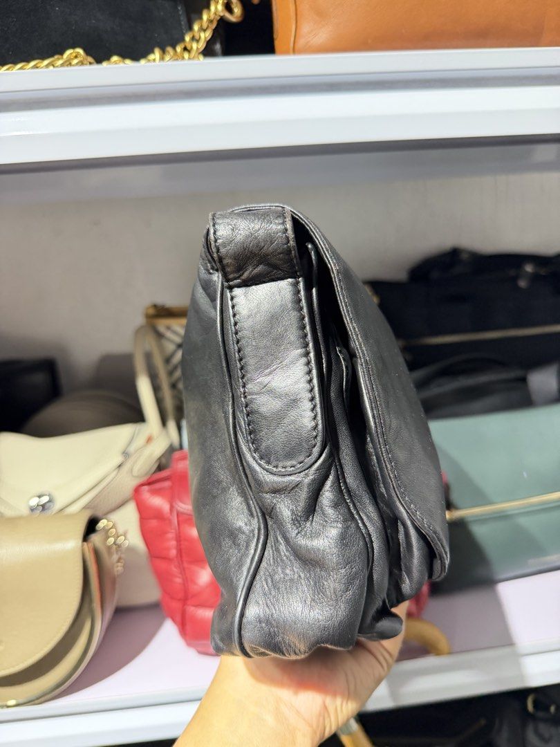 Loewe Anagram flap crossbody (Category: Luxury Bags & Wallets) located in Taguig. Submitted by xylasprelovedbag (Listing ID 1463960280, Image 3). Description: - Genuine black leather shoulder bag - Soft, slouchy silhouette - Front flap with embossed logo detail - Slightly textured leather finish - Versatile size for daily essentials - Immaculate interior - Adjustable shoulder strap.