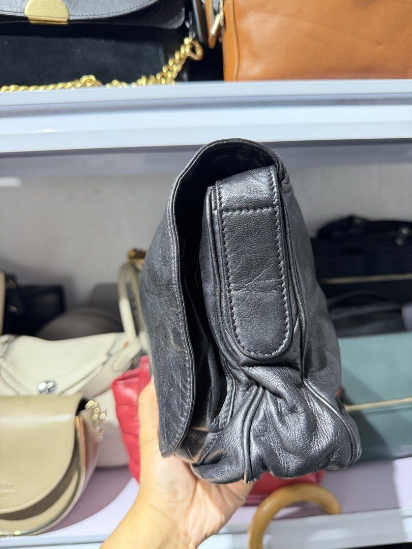 Loewe Anagram flap crossbody (Category: Luxury Bags & Wallets) located in Taguig. Submitted by xylasprelovedbag (Listing ID 1463960280, Image 2). Description: - Genuine black leather shoulder bag - Soft, slouchy silhouette - Front flap with embossed logo detail - Slightly textured leather finish - Versatile size for daily essentials - Immaculate interior - Adjustable shoulder strap.