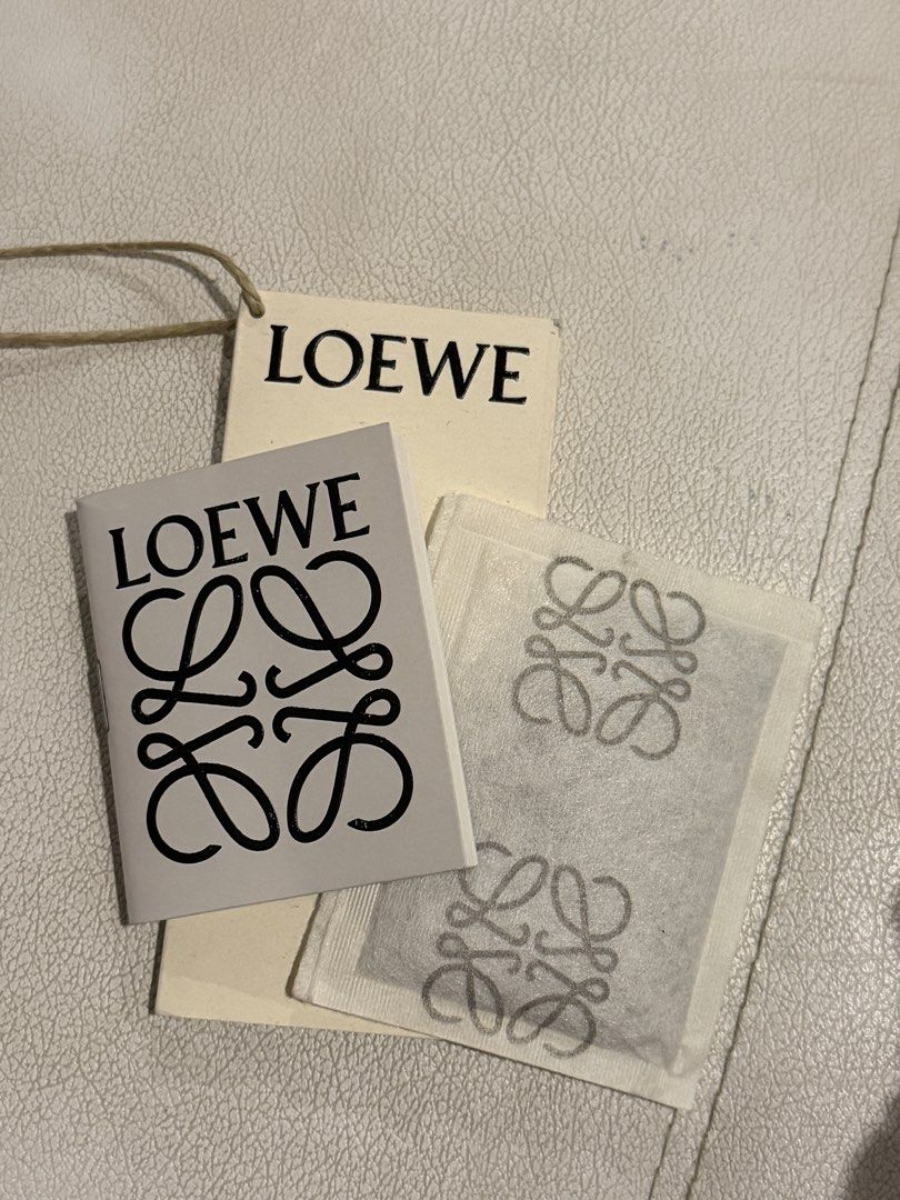 LOEWE BASKET IN MEDIUM (Category: Shoulder Bags) located in Quezon City. Submitted by xxyagirlxx (Listing ID 1463965072, Image 2). Description: - Brand new & Authentic Loewe Basket in Medium - Bought from SSI Event - Rattan - White leather handles and trim - Iconic Loewe anagram embossed on leather patch - Comes with original tags and dust bag RFS: Won’t be able to use this.