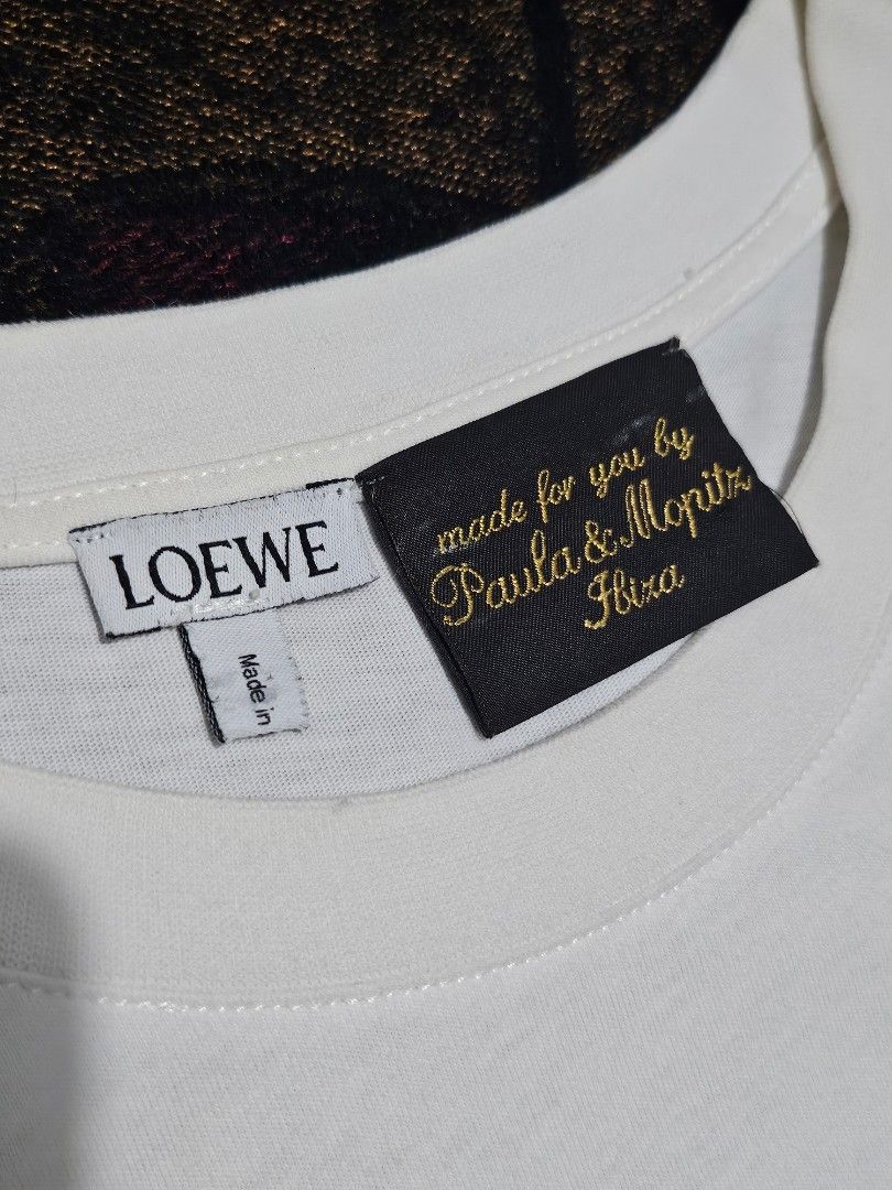 Loewe x Paula’s Ibiza "Paula's" Script Patch T-Shirt (Category: Luxury Apparel) located in Candelaria. Submitted by bentablesetc (Listing ID 1463981472, Image 3). Description: Loewe x Paula’s Ibiza "Paula's" Script Patch T-Shirt Medium on tag 19.5 x 26 600 + sf Loc: Candelaria Quezon.