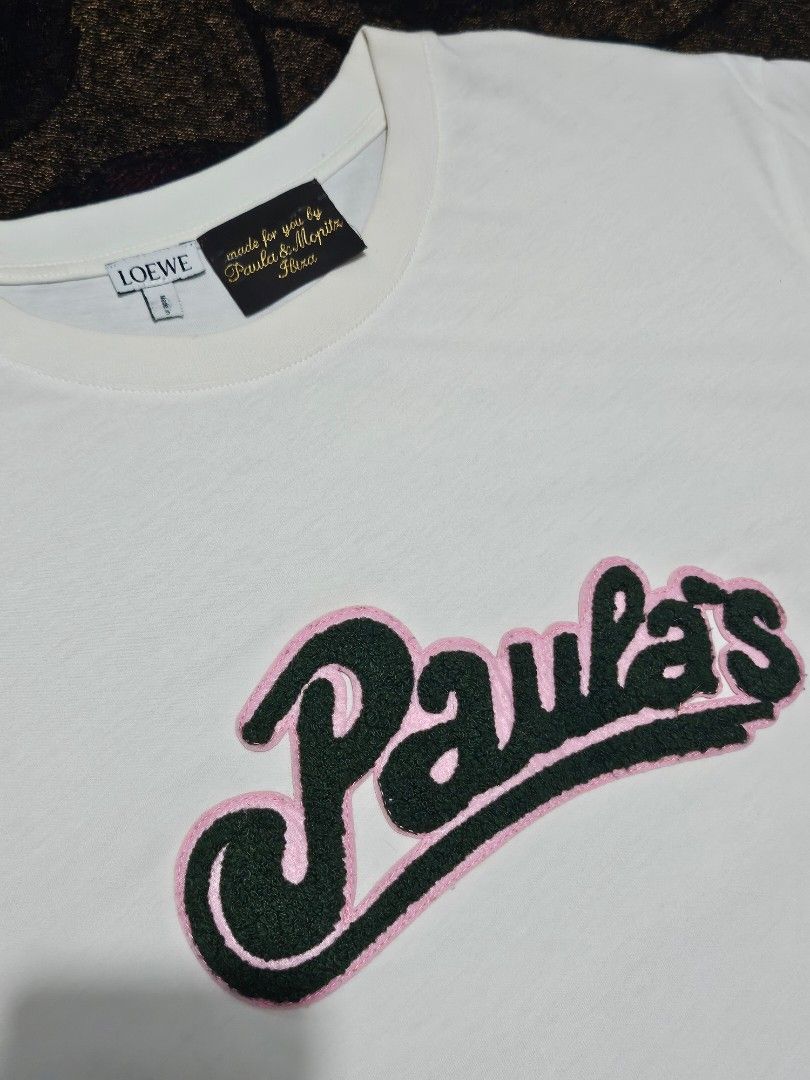 Loewe x Paula’s Ibiza "Paula's" Script Patch T-Shirt (Category: Luxury Apparel) located in Candelaria. Submitted by bentablesetc (Listing ID 1463981472, Image 2). Description: Loewe x Paula’s Ibiza "Paula's" Script Patch T-Shirt Medium on tag 19.5 x 26 600 + sf Loc: Candelaria Quezon.