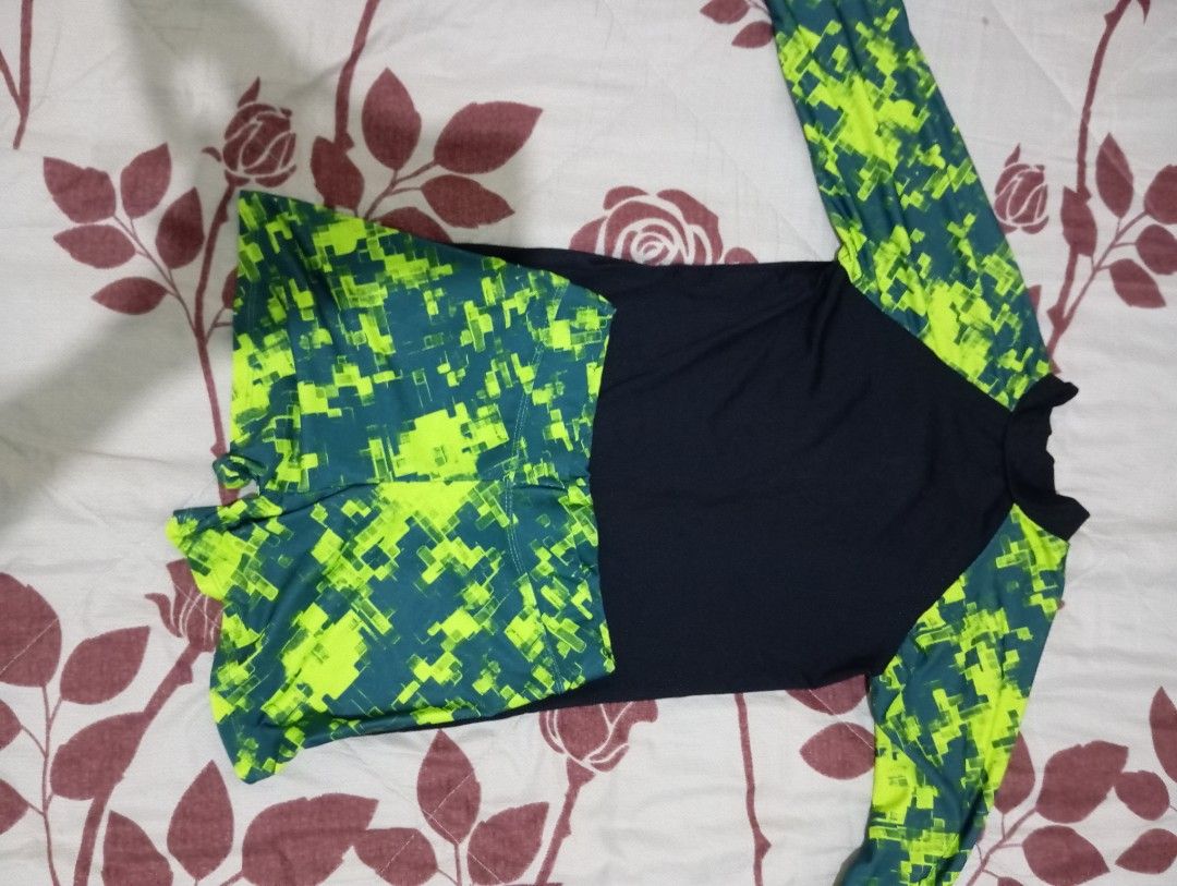 Long sleeve rash guard and shorts set (Category: Rash guard) located in Dasmarinas. Submitted by kei05 (Listing ID 1463958463, Image 2). Description: - Long sleeve rash guard top - Matching shorts - Black top with bright green and dark teal geometric sleeves - Geometric patterned shorts - Ideal for swimming and water sports - Comfortable and quick-drying fabric.