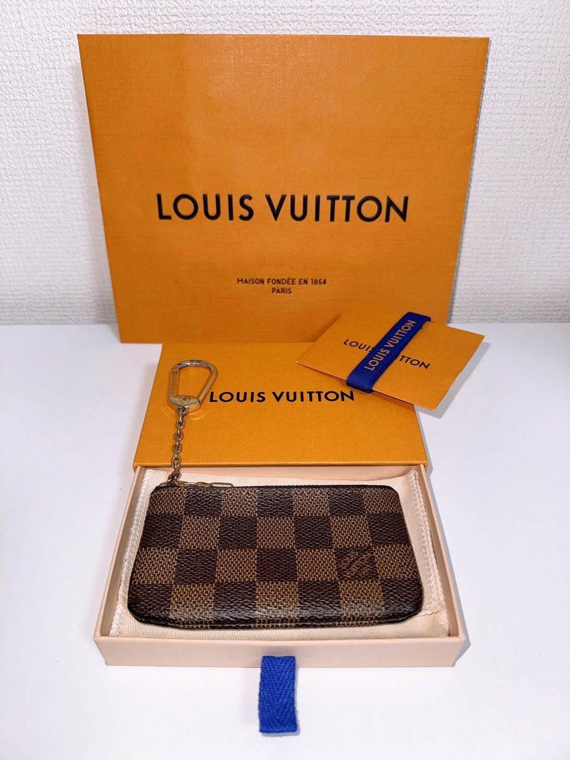 Louis Vuitton Damier Ebene Canvas Key Pouch (Category: Luxury Bags & Wallets) located in Manila. Submitted by arcietan02437 (Listing ID 1464048966, Image 3). Description: - Authentic Louis Vuitton Key Pouch - Damier Ebene Canvas - Zipper Closure - Includes Original Box - Includes Dust Bag - Ideal for Keys, Cards, or Coins - Classic LV Monogram Pattern May bakbak lng sa hardware .