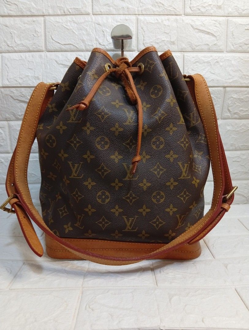 Louis Vuitton Monogram Bucket Bag (Category: Shoulder Bags) located in Las Pinas. Submitted by etoksi1234 (Listing ID 1464027327, Image 1). Description: Pre-loved Louis Vuitton Monogram Bucket Bag (Made in France). Features leather trim and drawstring. Adjustable strap. Shows normal signs of wear. Size: L-10" x H-13" x D-7".