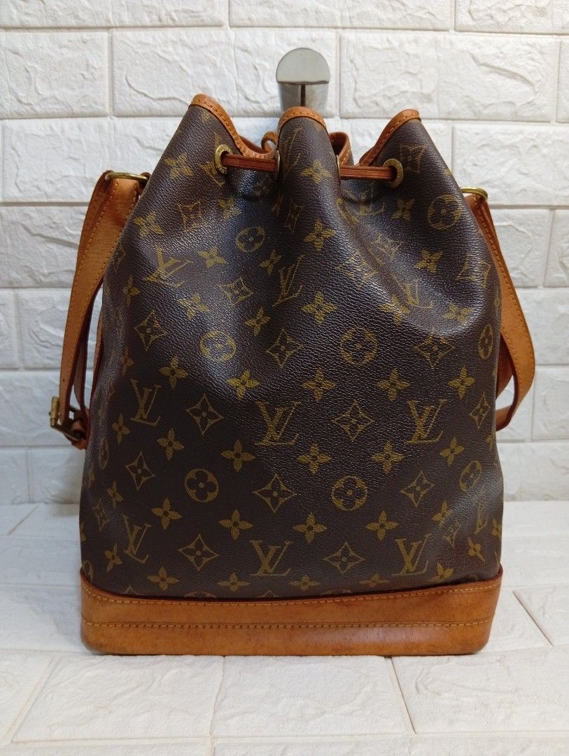Louis Vuitton Monogram Bucket Bag (Category: Shoulder Bags) located in Las Pinas. Submitted by etoksi1234 (Listing ID 1464027327, Image 2). Description: Pre-loved Louis Vuitton Monogram Bucket Bag (Made in France). Features leather trim and drawstring. Adjustable strap. Shows normal signs of wear. Size: L-10" x H-13" x D-7".