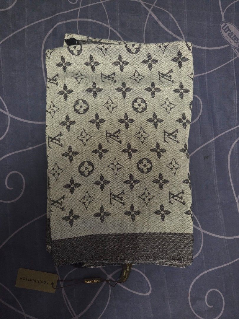 Louis Vuitton Monogram Scarf (Category: Scarves) located in Paranaque City. Submitted by antik-antik (Listing ID 1463982932, Image 1). Description: - Authentic Louis Vuitton scarf - Classic monogram pattern - Soft and comfortable material - Includes original tags - Versatile accessory for any outfit - Approximate measurements: [insert length] x [insert width].