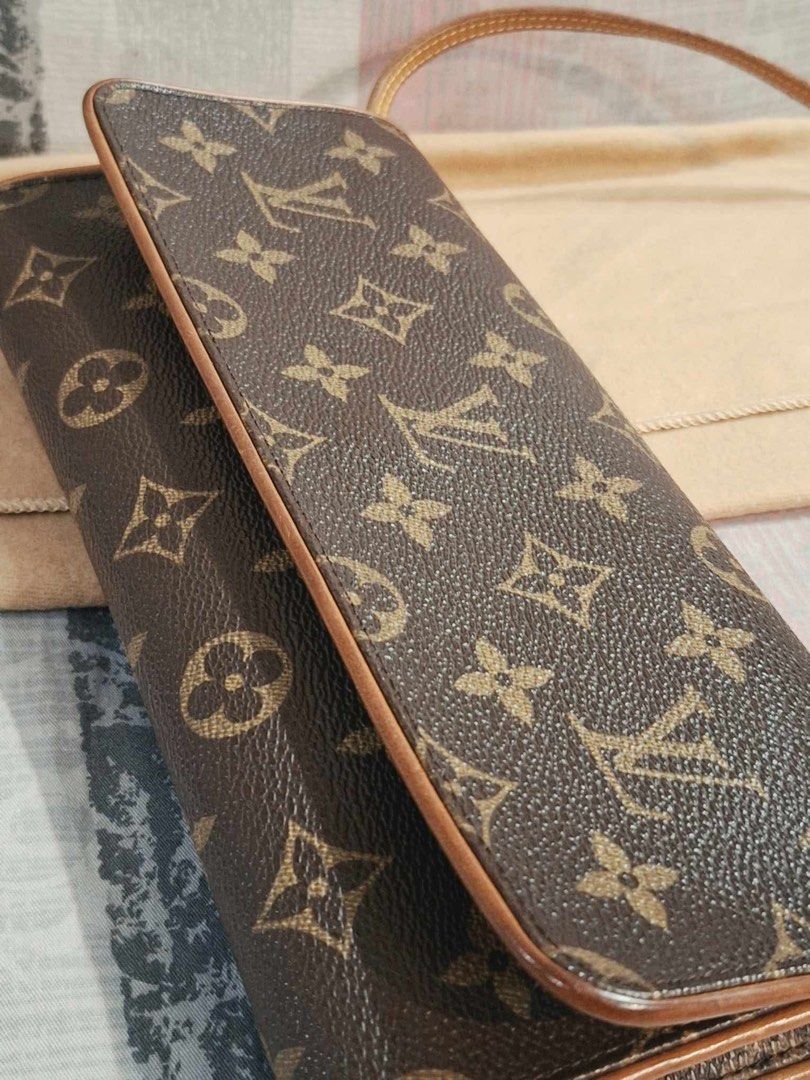 Louis Vuitton Monogram Twin Pochette (Category: Luxury Bags & Wallets) located in Manila. Submitted by ms.conv (Listing ID 1463979665, Image 1). Description: - Classic Louis Vuitton monogram wallet - Color: Brown canvas with tan leather trim - Closure: Snap - Includes: Dust bag - Ideal for carrying essentials.