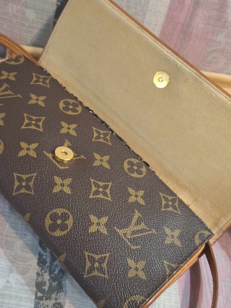 Louis Vuitton Monogram Twin Pochette (Category: Luxury Bags & Wallets) located in Manila. Submitted by ms.conv (Listing ID 1463979665, Image 2). Description: - Classic Louis Vuitton monogram wallet - Color: Brown canvas with tan leather trim - Closure: Snap - Includes: Dust bag - Ideal for carrying essentials.