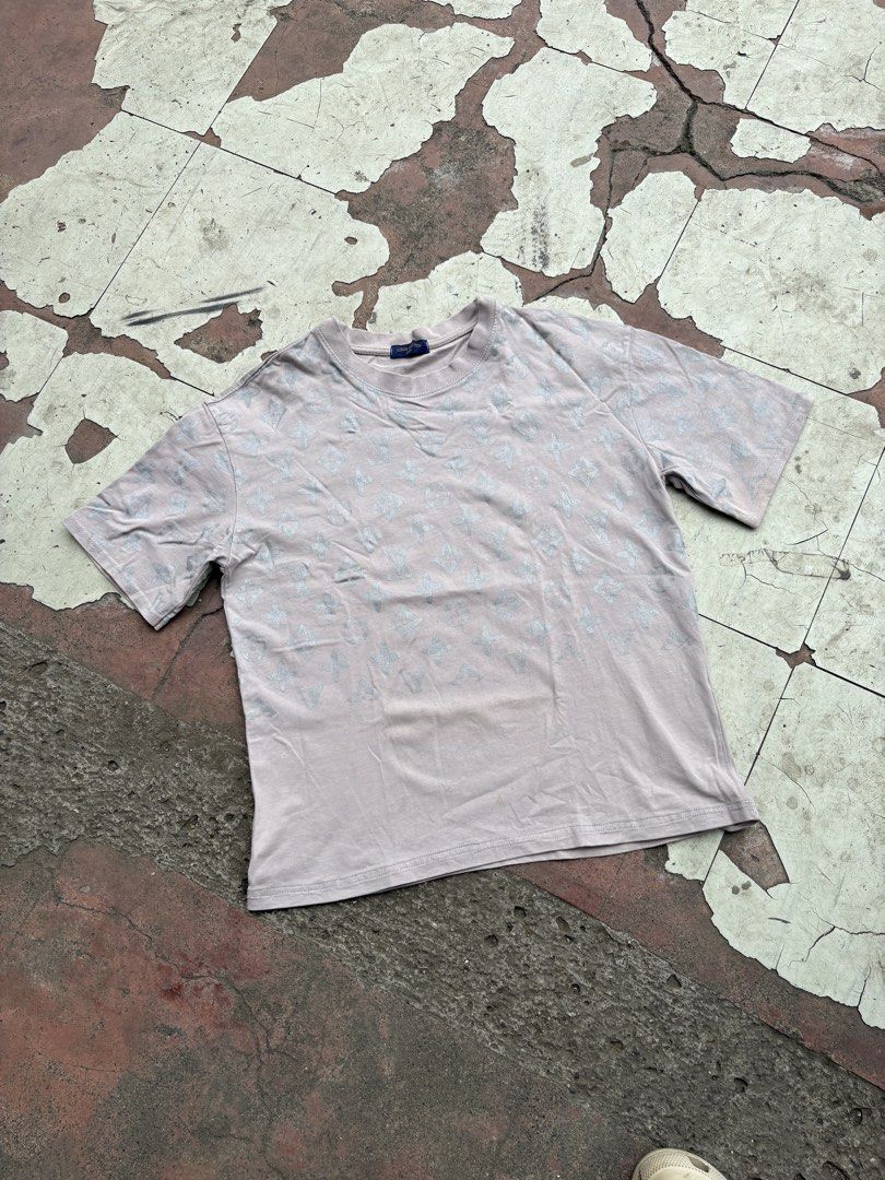 Louis Vuitton Paris Monogram T-Shirt (Category: Luxury Apparel) located in Iligan City. Submitted by seddicmoti2002 (Listing ID 1463980972, Image 2). Description: - Authentic light grey Louis Vuitton t-shirt - Features iconic all-over LV monogram pattern - Classic crew neck and short sleeves - Comfortable fabric for everyday wear - Ideal for a stylish casual look - Authenticity guaranteed by label.