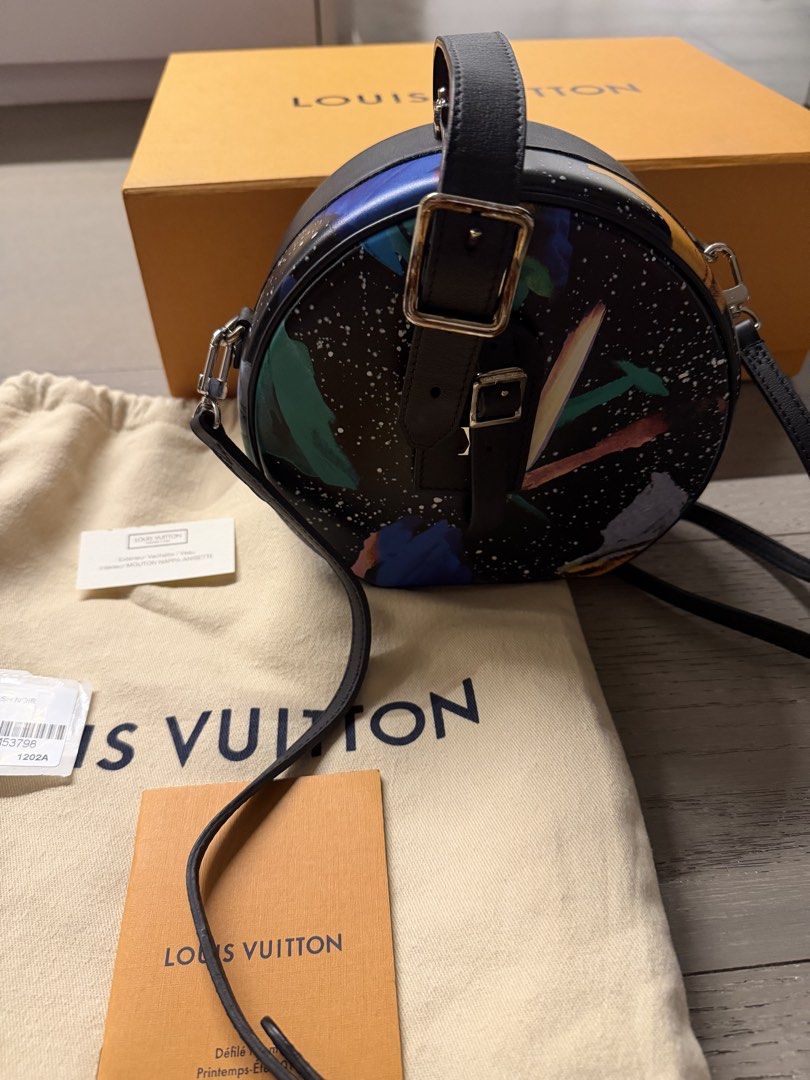 Louis Vuitton Round Bag Splash Noir (Category: Luxury Bags & Wallets) located in Makati City. Submitted by arkera.274 (Listing ID 1464050827, Image 2). Description: Authentic Louis Vuitton round crossbody bag. Features the Splash Noir print. Comes with dust bag, box, and authenticity cards. Lock closure. Adjustable strap. Great for a statement piece..